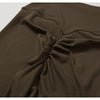 A close-up of a dark brown women's performance tracksuit set fabric draped and folded.
