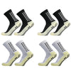 Ein Viererpack strapazierfähige rutschfeste Sportsocken schwarz-weiß von der Seite