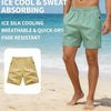A man wearing light green ice silk cooling breathable and quick-dry shorts on a beach.