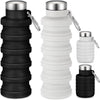 A set of black and white collapsible silicone travel water bottles with metal clasps.