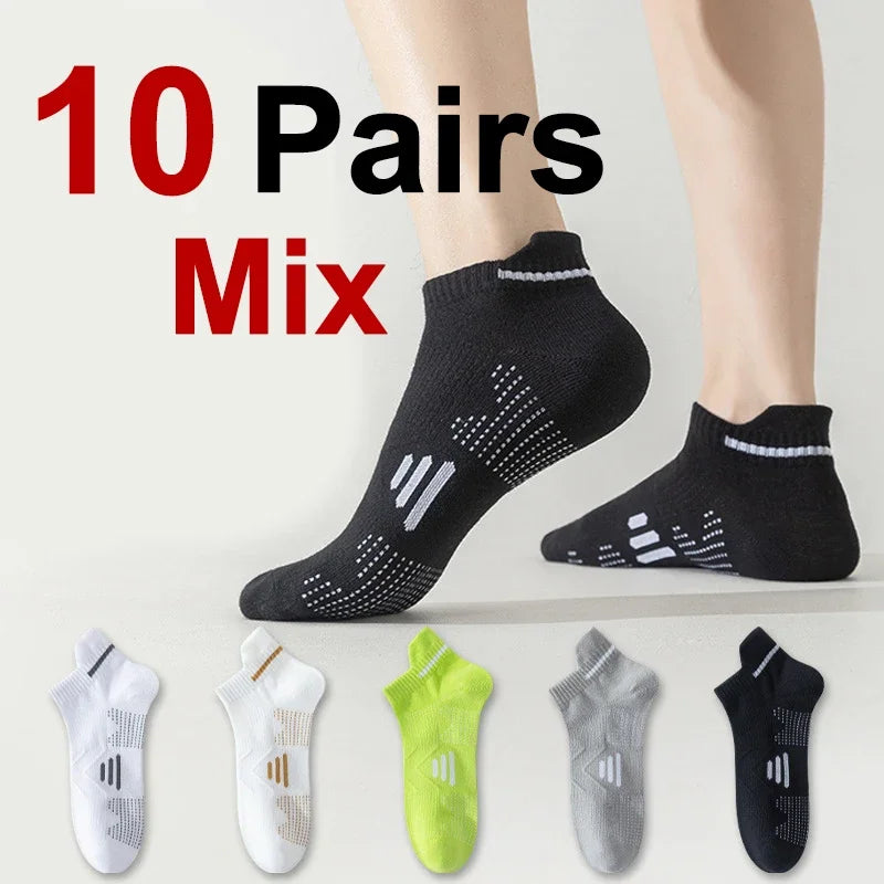 Ten pairs of black athletic socks displayed on a person's foot and various colors.