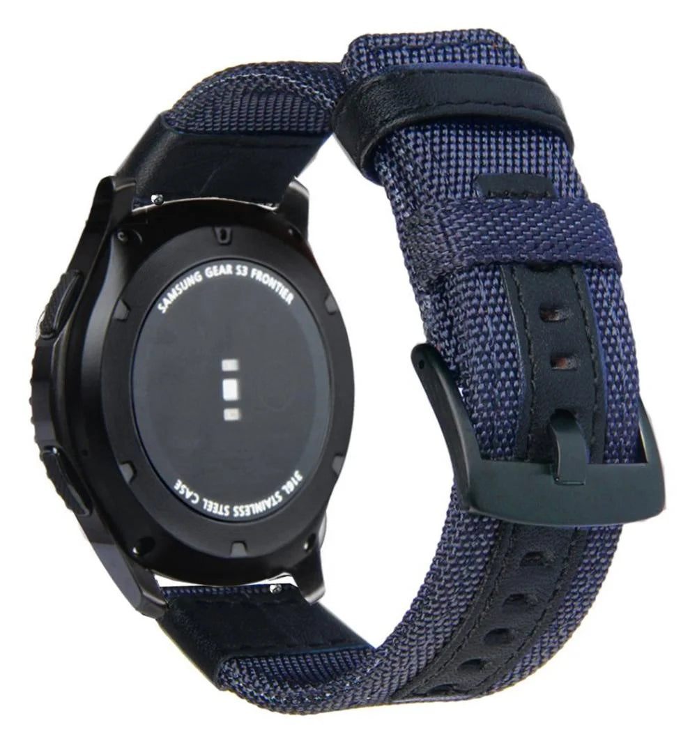 A black Samsung Gear S3 Frontier watch with a dark blue nylon quick release band.