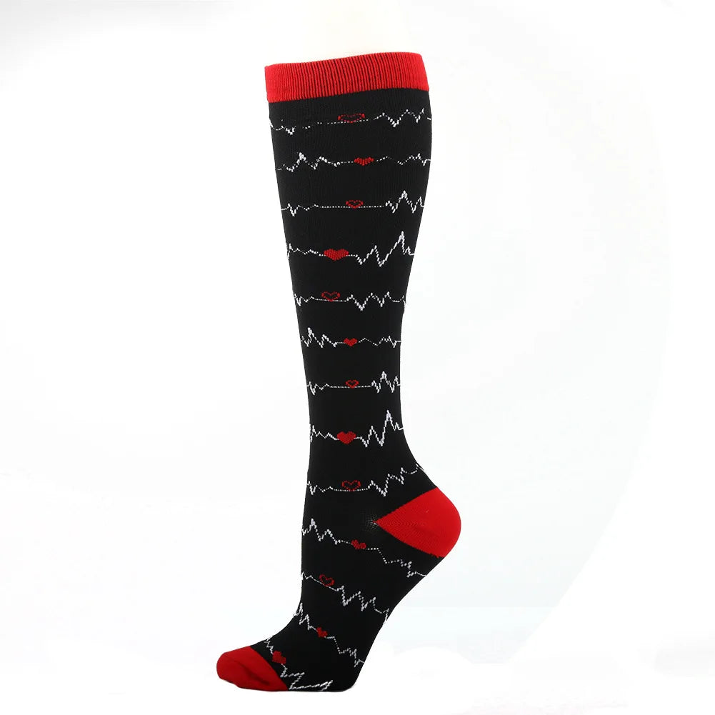 Black compression socks with red cuff featuring a heart rate line pattern.