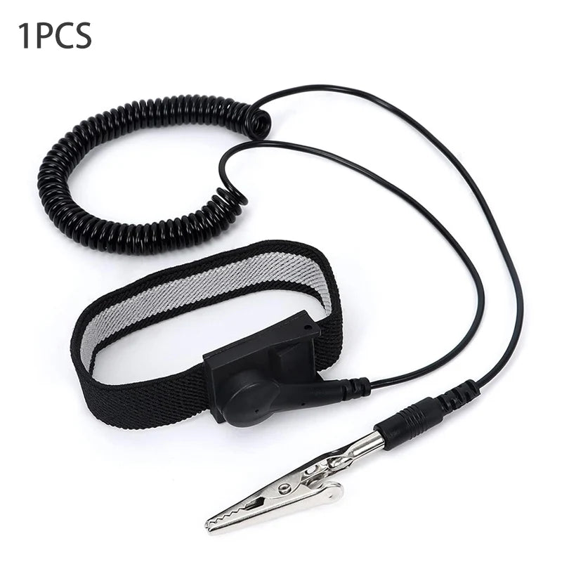 A black adjustable ESD wrist strap with a clip and a metal prong is shown for electronics safety.