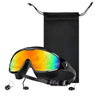 A pair of black anti-fog UV swim goggles with orange and green lenses is displayed against a black fabric bag.