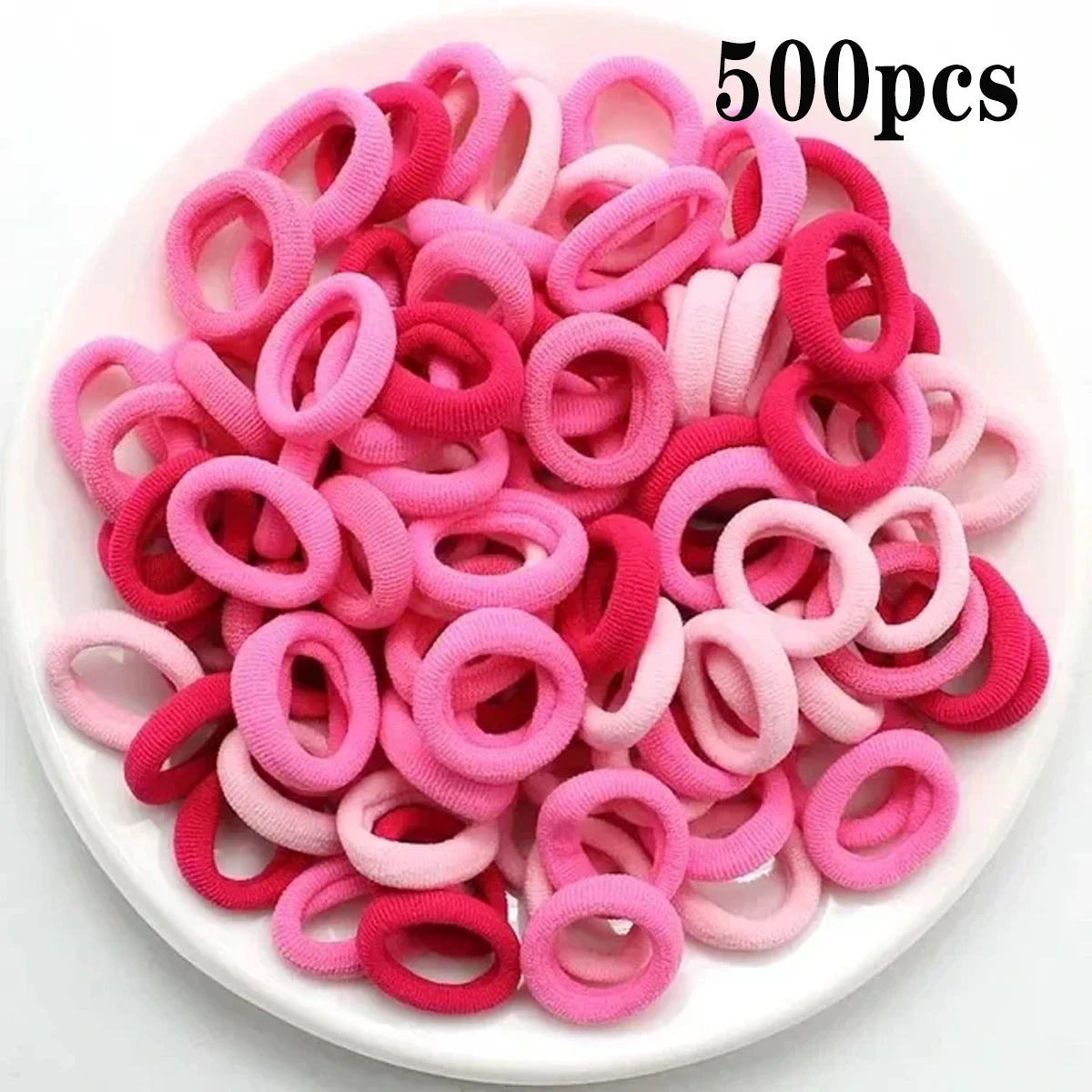 Haufen von 500 rosa und magentafarbenen Nylon-Haargummis für Pferdeschwänze und Zöpfe.