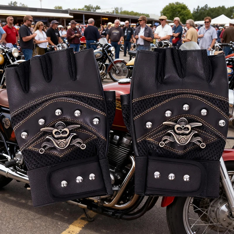 A pair of black leather motorcycle riding gloves featuring a pirate skull design on the back, displayed on a motorcycle.