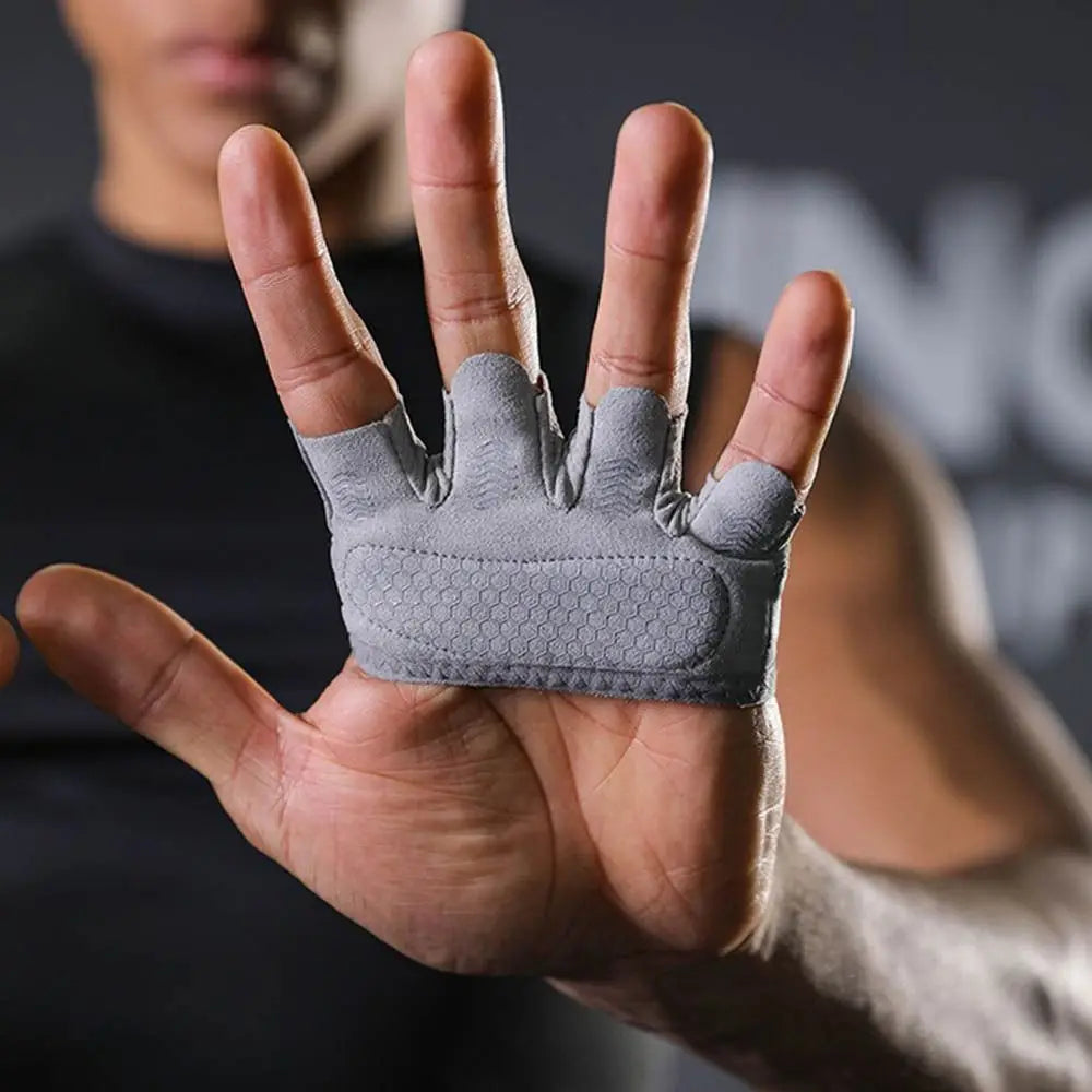 A hand wearing gray ergonomic anti-slip gym lifting gloves, shown in a close-up view.