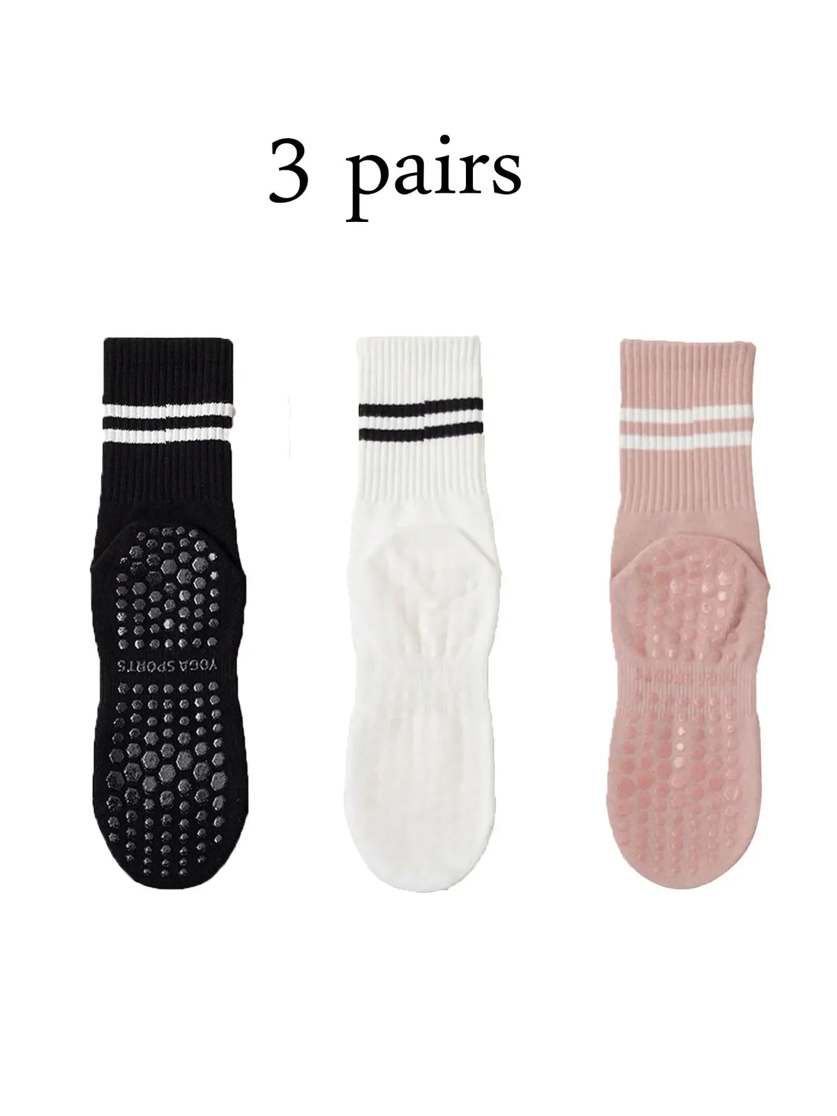 Three pairs of grip socks for yoga and barre, featuring black, white, and pink colors.