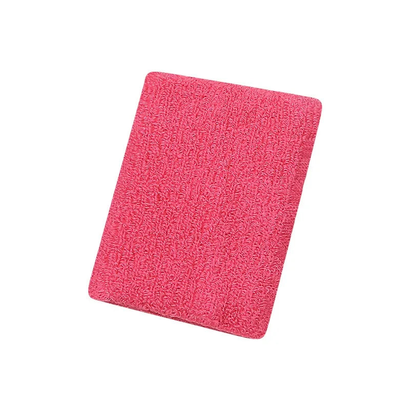 A bright pink, textured multi-sport breathable wristband for activewear.