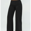 Black flared high-waist yoga pants worn by a model.