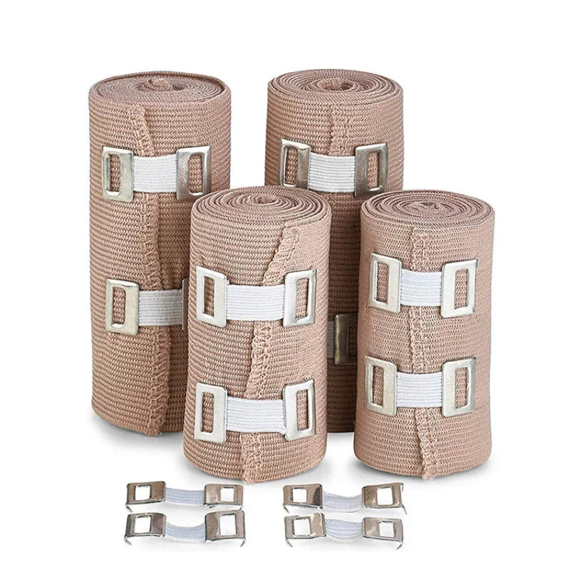 Three rolls of beige elastic skin tone tendon bandages with silver buckles.