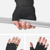 Black heavy-duty weightlifting grips being held onto a silver bar.