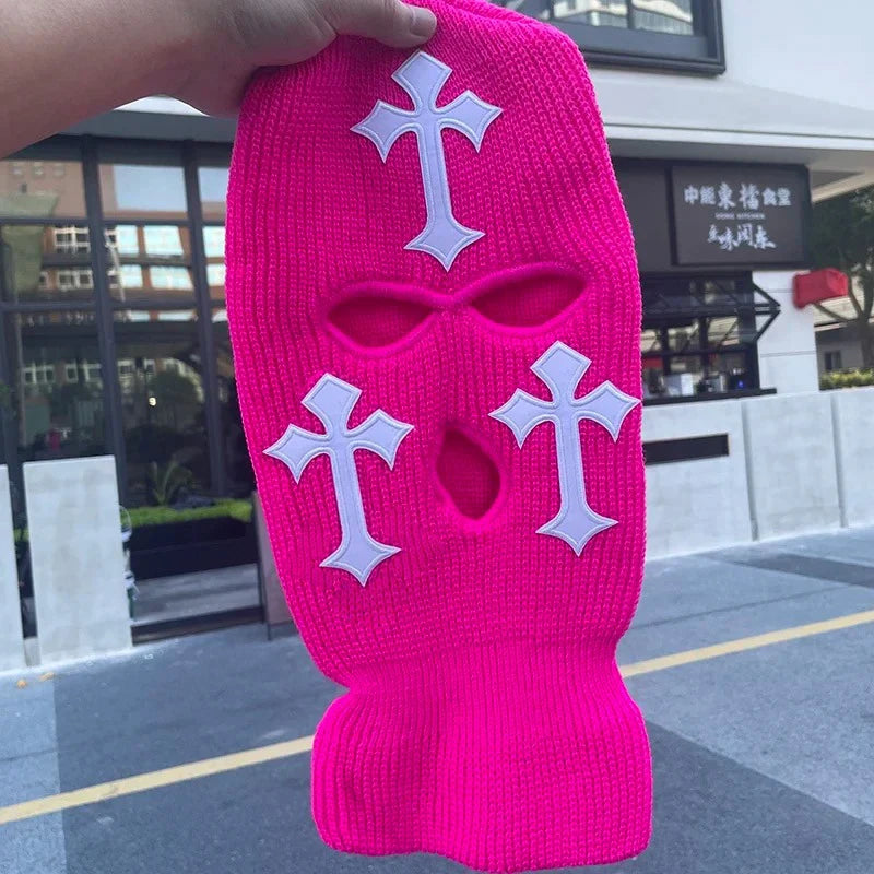 A bright pink tactical knit balaclava beanie hat featuring white cross designs.