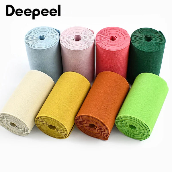 Rolls of colorful adjustable elastic bands for sewing and decoration in various shades of pink, red, green, yellow, and beige