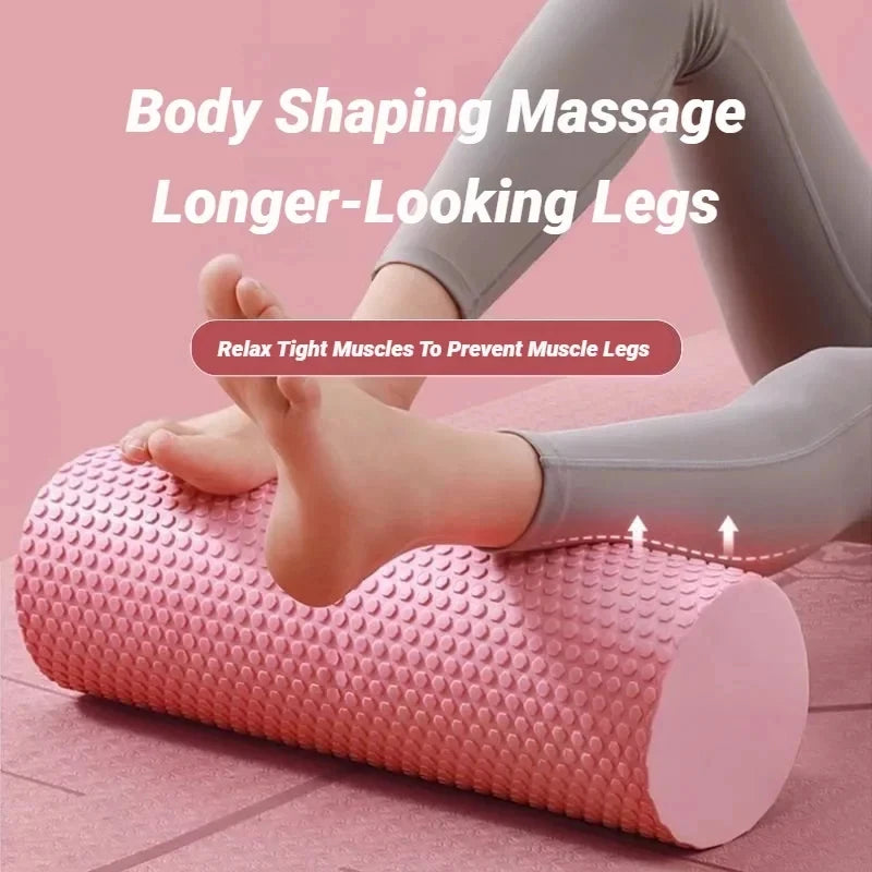 A person is using a pink body shaping massage roller on their legs to relax tight muscles.