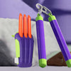 A purple carrot-shaped fidget toy with orange tips is shown next to a green fidget toy.
