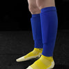 A close-up of a person's lower leg wearing royal blue compression socks and yellow athletic shoes.