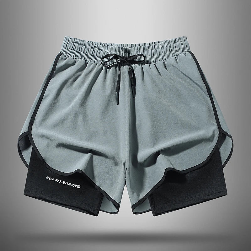 Gray athletic shorts with black trim and drawstring, shown flat lay.