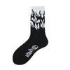 Black novelty socks featuring a white flame pattern design