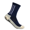 Calcetines deportivos azules marinos antideslizantes con puntos blancos y un puño gris claro