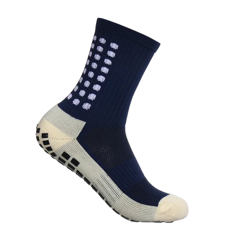 Calcetines deportivos azules marinos antideslizantes con puntos blancos y un puño gris claro