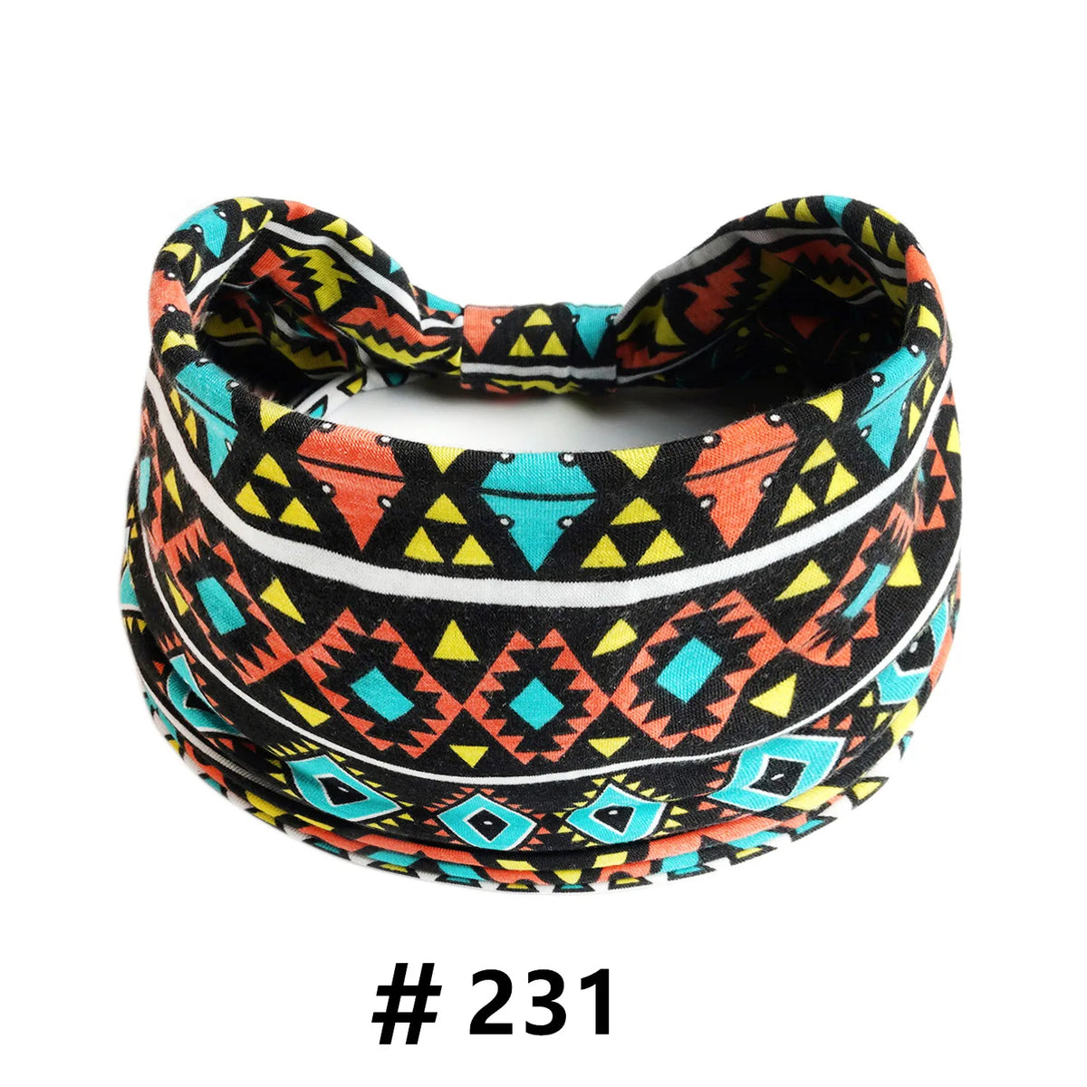 A black and orange patterned boho cotton turban headband worn around the head.