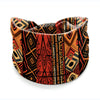 A close-up of a patterned bohemian stretch cotton headband featuring geometric designs in orange, black, and rust tones.