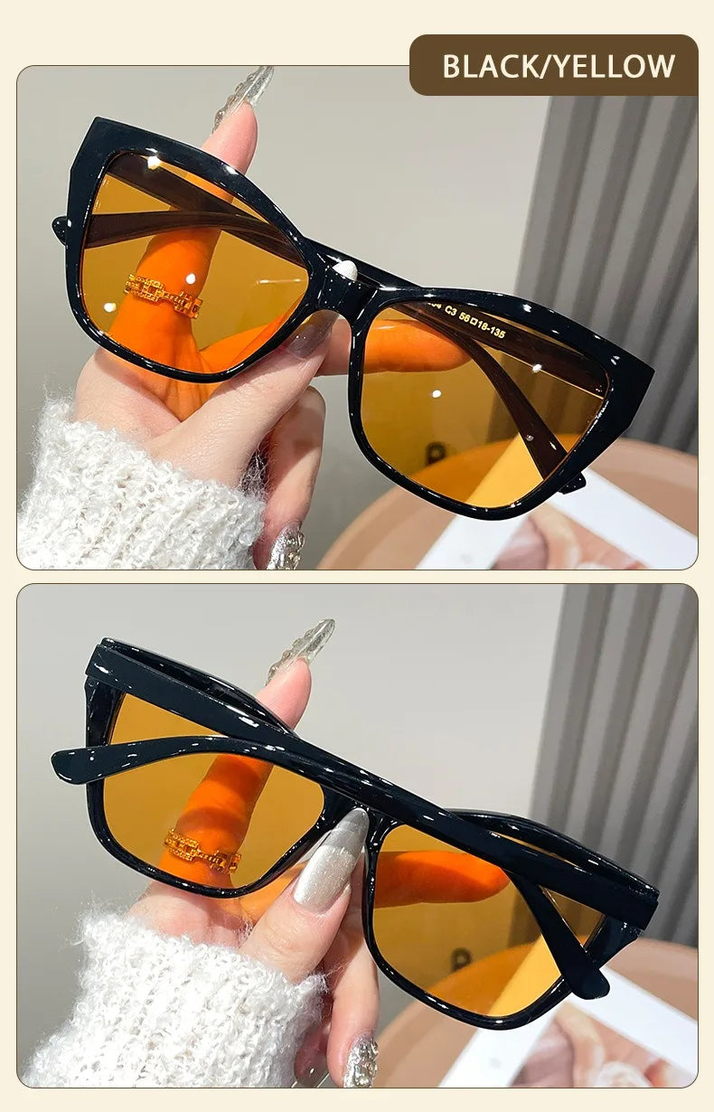 Black and yellow vintage square cat eye sunglasses with orange lenses shown on a hand