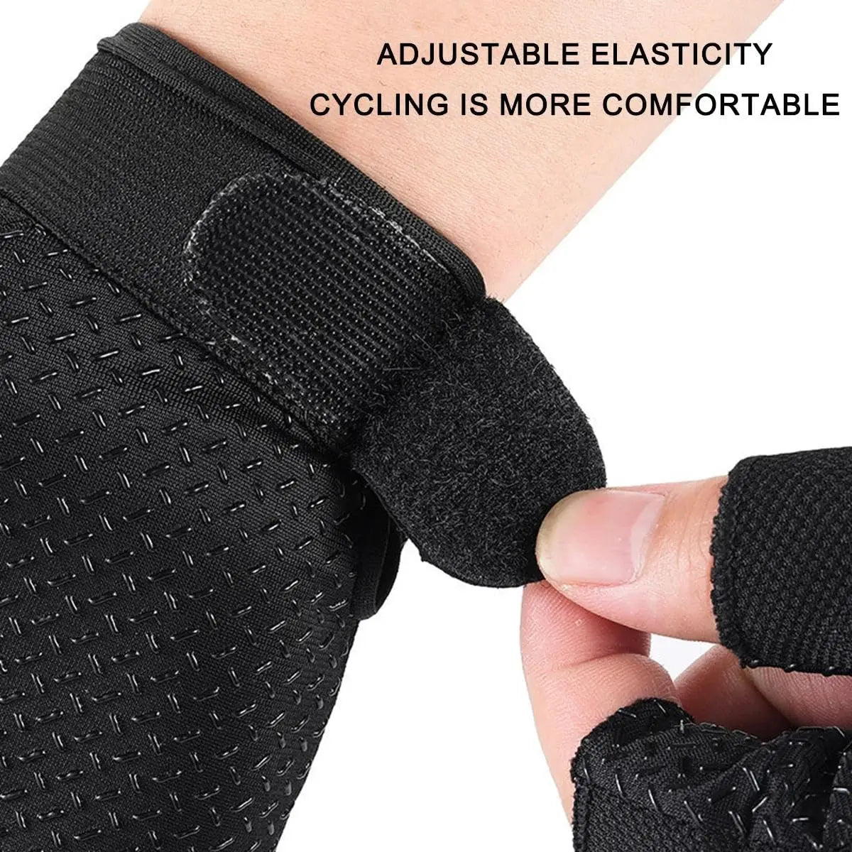 Black breathable half-finger cycling and fitness gloves being adjusted on a hand.