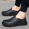 A pair of black men's anti-slip oil-resistant kitchen clogs shown from the side.