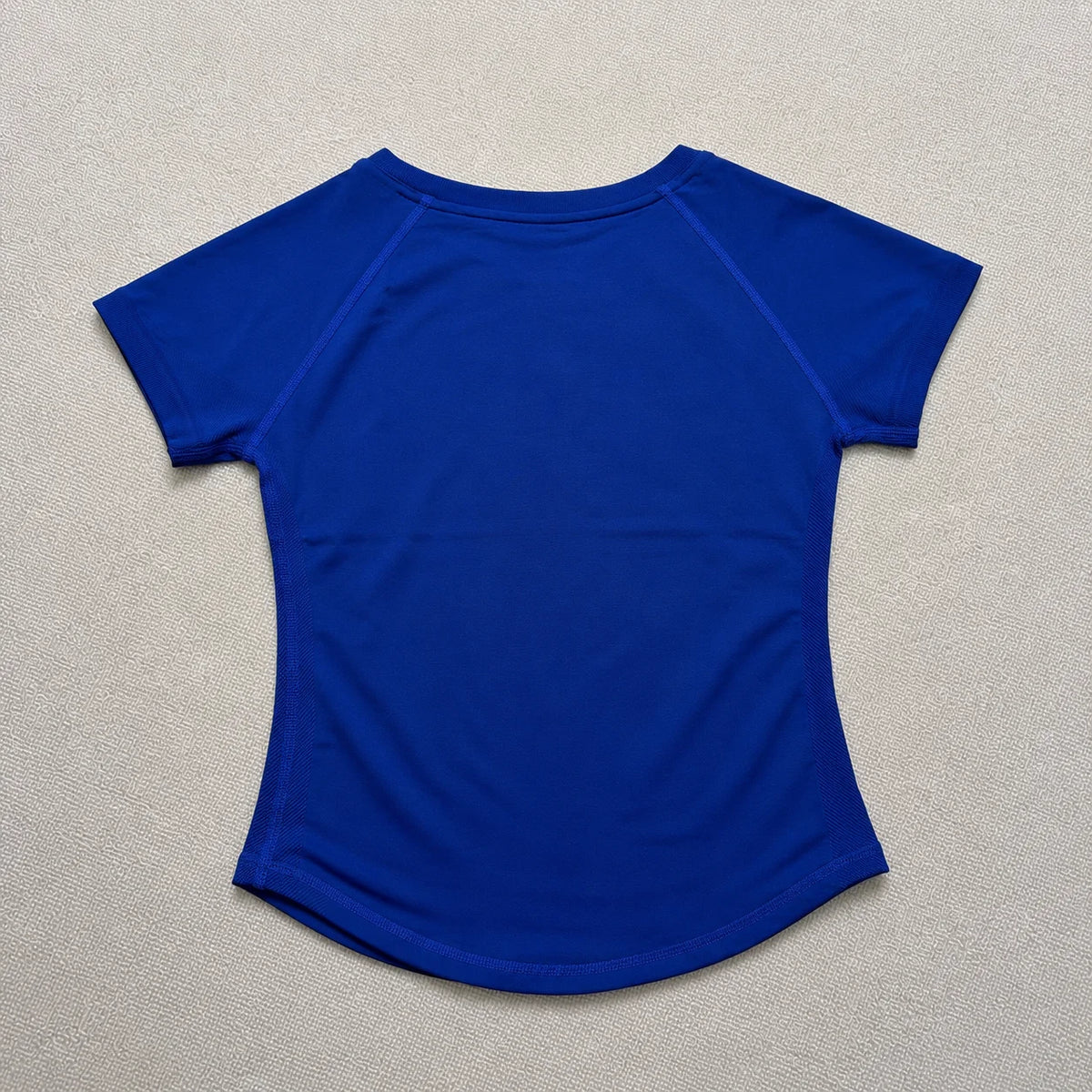 A royal blue seamless high-waist yoga top for women shown against a light background.