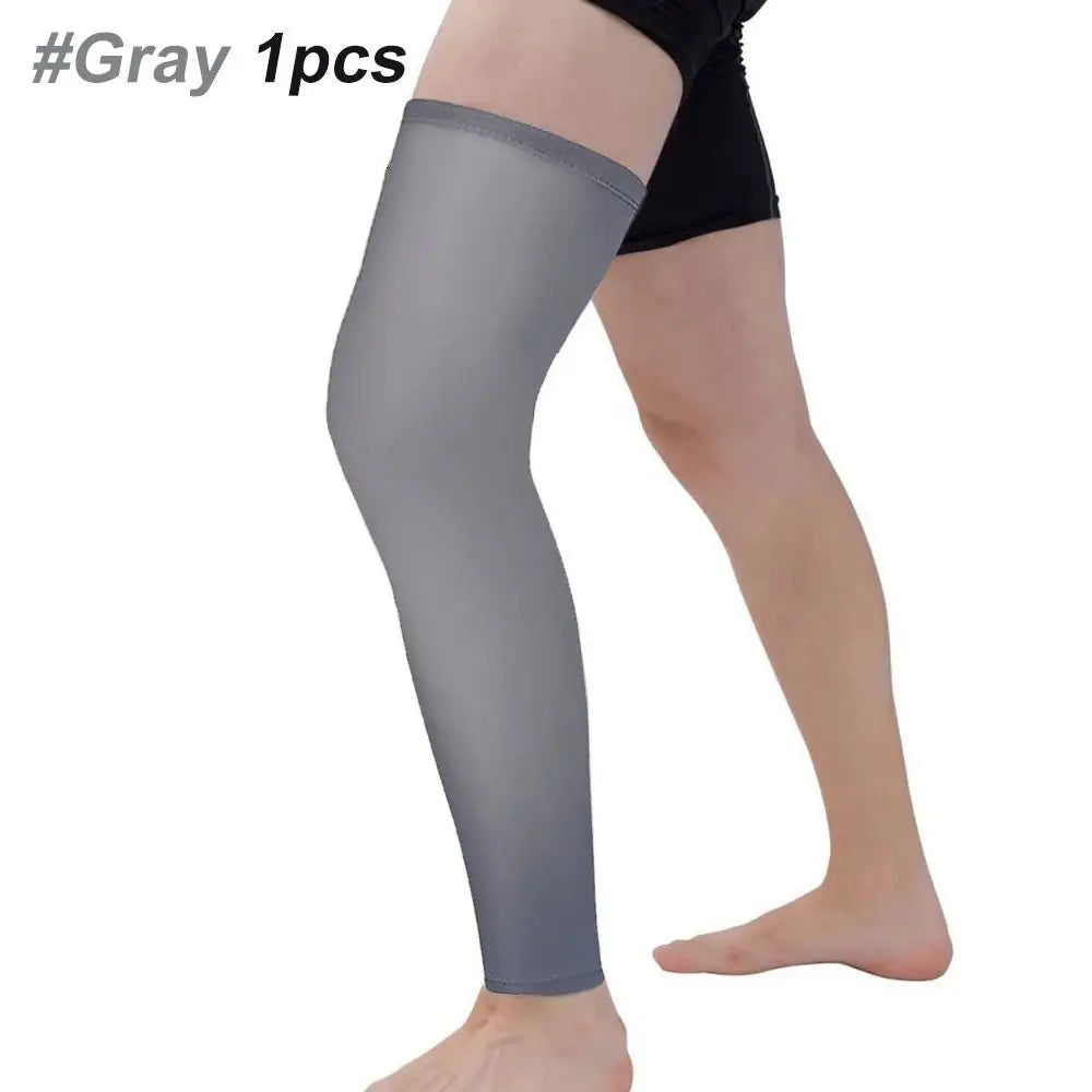 Gray knee calf compression sleeve worn on a leg.