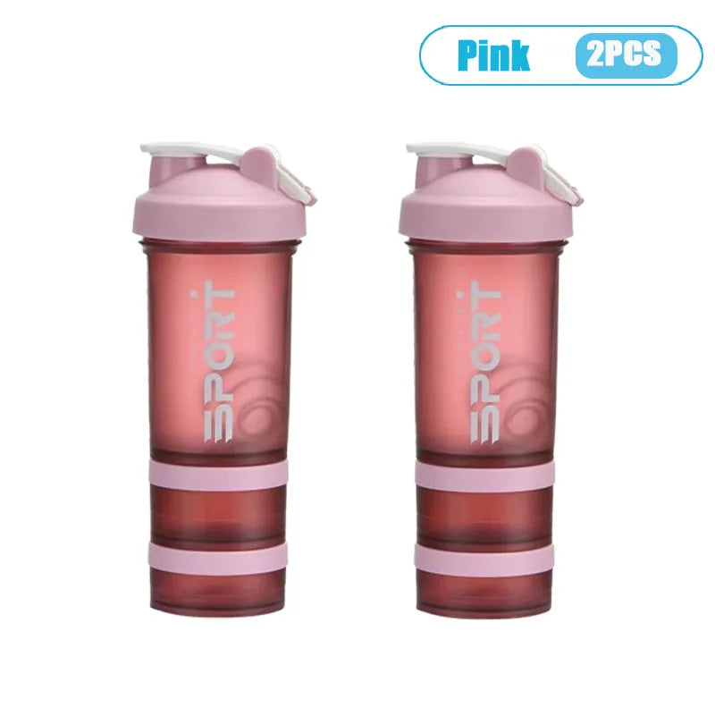 Pink 3-layer protein shaker bottle with handle, shown in a vertical view.
