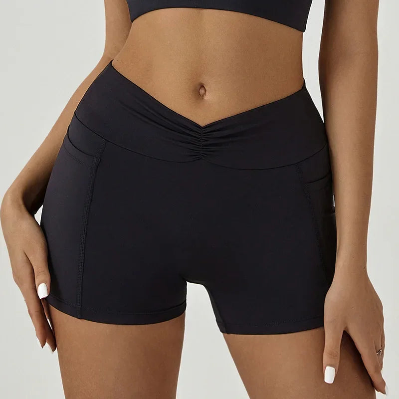 A model wearing dark navy high-waisted yoga and fitness leggings.