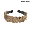 A beige braided hair accessory made from light brown hair, styled in a thick rope braid.