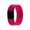 A vibrant magenta stretch silicone wristband featuring a floral pattern and a black band.
