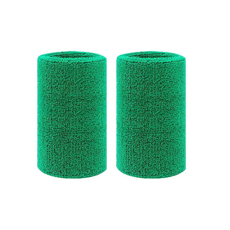A pair of green dual sports wristbands for sweat absorption, cylindrical in shape.