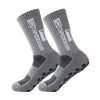 A pair of gray anti-slip performance sports socks shown from the side.