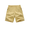 Tan men's lightweight quick-dry running shorts shown flat lay