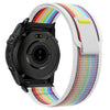 A black Garmin sports watch with a multi-colored nylon strap is shown from the side.