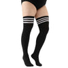 Black striped thigh high leg warmers worn on a person's legs.