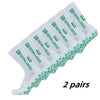 Two pairs of white non-slip grip football socks with green accents