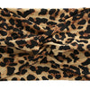 A close-up of a women's elastic sports headband made from brown and black leopard print fabric.