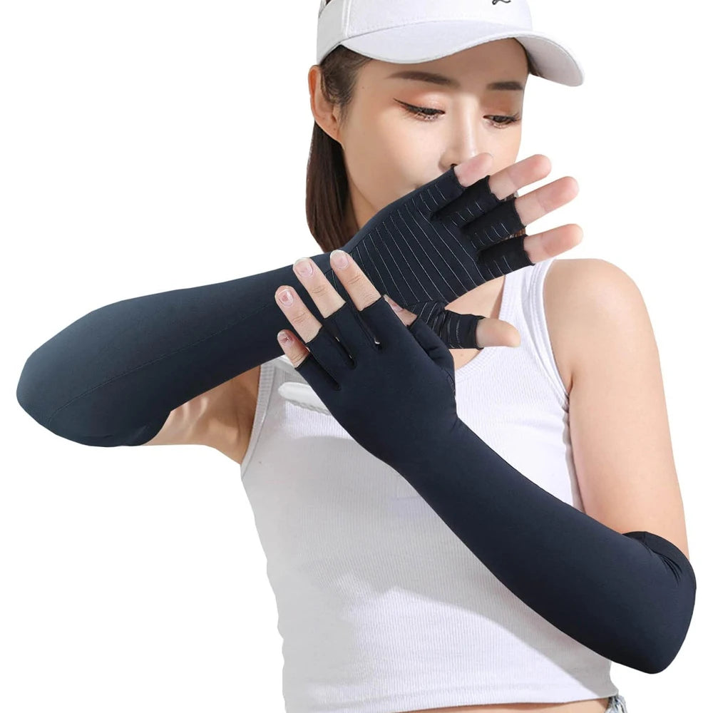 A person is wearing black compression gloves on their hands, demonstrating the fit of the arthritis compression gloves.