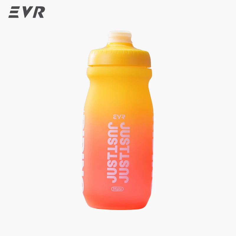 A clear plastic squeezable cycling water bottle filled with orange-yellow liquid.