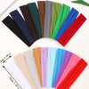 Three pieces of random colored stretchable cotton sweat absorbing headbands laid out on a white background.