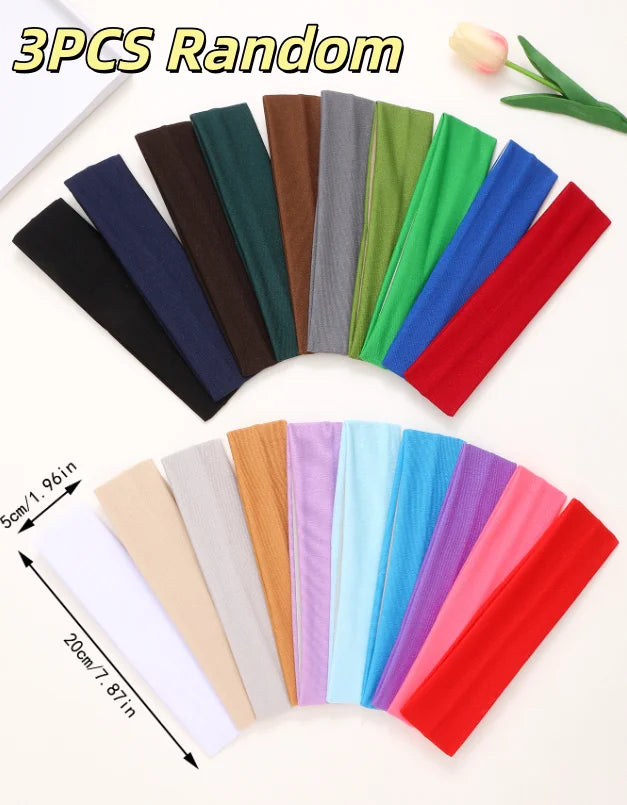 Three pieces of random colored stretchable cotton sweat absorbing headbands laid out on a white background.