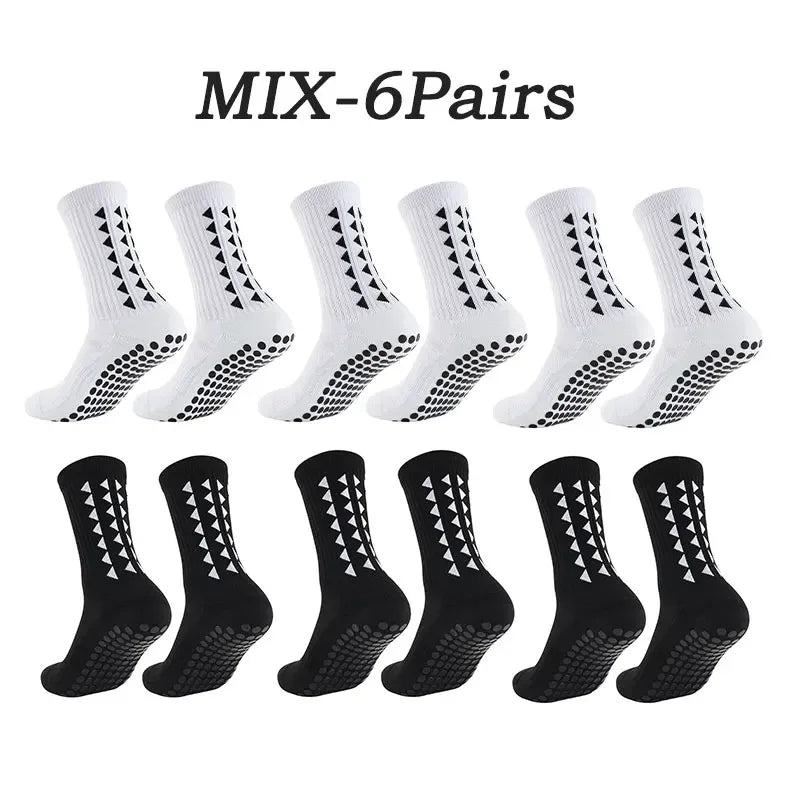 Six pairs of black athletic grip socks with white geometric patterns.