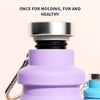 A purple silicone travel water bottle with a silver cap and a blue component is shown.